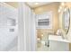 Simple bathroom with white subway tile and pedestal sink at 1827 N Bellaire St, Denver, CO 80220