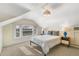 Upstairs bedroom with dormer windows and neutral decor at 1827 N Bellaire St, Denver, CO 80220