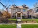 Charming two-story home with a manicured front yard, classic architectural details, and a welcoming entryway at 1827 N Bellaire St, Denver, CO 80220