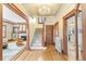 Inviting foyer with hardwood floors, staircase, and classic architectural details at 1827 N Bellaire St, Denver, CO 80220