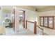 Upper hallway with stained glass window, access to bedrooms at 1827 N Bellaire St, Denver, CO 80220