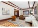 Bright living room features hardwood floors, a decorative fireplace, and stylish, comfortable furnishings at 1827 N Bellaire St, Denver, CO 80220