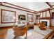 Bright living room features hardwood floors, a decorative fireplace, and stylish, comfortable furnishings at 1827 N Bellaire St, Denver, CO 80220