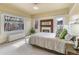 Elegant main bedroom with decorative fireplace, stained glass window, and natural light at 1827 N Bellaire St, Denver, CO 80220