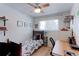 Stylish bedroom with a dark wood bed frame, ample natural light, and a spacious desk at 7966 Ingalls St, Arvada, CO 80003