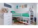 Fun bedroom with a bunk bed, playful decor, and ample storage at 7966 Ingalls St, Arvada, CO 80003