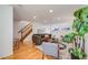 Bright living room with hardwood floors and stylish furniture at 410 Smith Cir, Erie, CO 80516