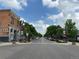 Scenic street view of a charming town with shops and trees at 410 Smith Cir, Erie, CO 80516