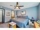 Bedroom with ensuite bathroom access, ceiling fan, and ample space at 5745 W Atlantic Pl # 104, Lakewood, CO 80227