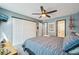 Bright bedroom boasts a ceiling fan, large closet, and ensuite bathroom access for convenience at 5745 W Atlantic Pl # 104, Lakewood, CO 80227