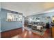 Inviting living room with a large sectional sofa, area rug, and natural light at 5745 W Atlantic Pl # 104, Lakewood, CO 80227