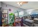 Bright living area with hardwood floors, gray sectional sofa, and a dining nook at 5745 W Atlantic Pl # 104, Lakewood, CO 80227