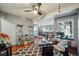 View of office area showing desk, ceiling fan, and open concept living space at 5745 W Atlantic Pl # 104, Lakewood, CO 80227