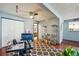 Home office space with ceiling fan, wood floors, area rug, and built-in storage at 5745 W Atlantic Pl # 104, Lakewood, CO 80227