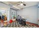 Cozy office area features a ceiling fan, natural light, and a stylish black and white area rug at 5745 W Atlantic Pl # 104, Lakewood, CO 80227