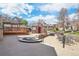 Condo community area featuring an outdoor patio with tables, chairs, fire pit, and landscaping at 5745 W Atlantic Pl # 104, Lakewood, CO 80227