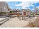 Condo community area featuring an outdoor patio with tables, chairs, and landscaping at 5745 W Atlantic Pl # 104, Lakewood, CO 80227