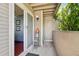 Condo patio featuring a side closet, sliding glass door, small shelving unit, and privacy wall at 5745 W Atlantic Pl # 104, Lakewood, CO 80227
