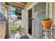 View of the condo patio with a sliding glass door, stool, and outside view at 5745 W Atlantic Pl # 104, Lakewood, CO 80227