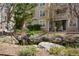 Pond surrounded by rocks and landscaping; building in the background at 5745 W Atlantic Pl # 104, Lakewood, CO 80227