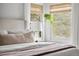 Bright bedroom featuring a plush bed, stylish window treatments, and natural light at 6686 E Jamison Ave, Centennial, CO 80112