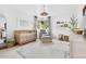 Bright Bedroom featuring a crib, comfortable seating, neutral colors, and natural light at 6686 E Jamison Ave, Centennial, CO 80112