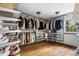 Walk-in closet with custom shelving, closet organizers and natural light at 6686 E Jamison Ave, Centennial, CO 80112