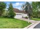 Charming one-story home with a two car garage, well maintained lawn and beautiful landscaping at 6686 E Jamison Ave, Centennial, CO 80112