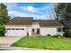 Beautiful home with a well-manicured front yard, and a cozy porch at 6686 E Jamison Ave, Centennial, CO 80112