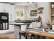 Updated kitchen with stainless steel appliances, stone countertops, and views to the backyard at 6686 E Jamison Ave, Centennial, CO 80112