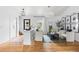 Bright, open-concept living room with hardwood floors, stylish decor, and lots of natural light at 6686 E Jamison Ave, Centennial, CO 80112