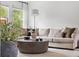 Bright living room with neutral color palette, modern decor and lots of natural light at 6686 E Jamison Ave, Centennial, CO 80112