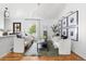 Bright, open-concept living room with hardwood floors, modern decor, and lots of natural light at 6686 E Jamison Ave, Centennial, CO 80112