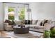 Comfortable living room with lots of natural light, modern decor and neutral colors at 6686 E Jamison Ave, Centennial, CO 80112