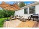 Inviting patio area with comfortable seating, a fire pit, and a large umbrella for shade and enjoyment at 6686 E Jamison Ave, Centennial, CO 80112