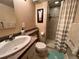 Cozy bathroom showcasing a tiled shower with a neutral-toned vanity and a decorative rug at 85 S Sherwood Gln, Monument, CO 80132