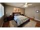 Tranquil bedroom showcasing a plush rug, wooden frame bed, and shuttered windows at 85 S Sherwood Gln, Monument, CO 80132