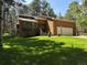 Charming single-Gathering home featuring a lush lawn, attached garage, and mature trees at 85 S Sherwood Gln, Monument, CO 80132