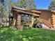 Inviting property with well-kept lawn, mature landscaping, and easy access with front steps at 85 S Sherwood Gln, Monument, CO 80132