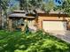 Attractive home with a manicured lawn, charming front porch, and a convenient two-car garage at 85 S Sherwood Gln, Monument, CO 80132
