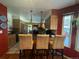 Charming kitchen featuring island with barstool seating and stainless steel appliances at 85 S Sherwood Gln, Monument, CO 80132