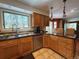 Well-lit kitchen with granite countertops, stainless steel appliances, and view of nature at 85 S Sherwood Gln, Monument, CO 80132