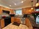 Well-lit kitchen offers wood cabinetry, granite countertops, and modern stainless steel appliances at 85 S Sherwood Gln, Monument, CO 80132