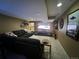Comfortable living room features a large sectional, entertainment center, and modern decor at 85 S Sherwood Gln, Monument, CO 80132
