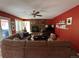 Cozy living room features brick fireplace, hardwood floors, and an inviting atmosphere at 85 S Sherwood Gln, Monument, CO 80132