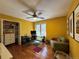 Bright office featuring built-in shelving, a ceiling fan, and a cozy green couch at 85 S Sherwood Gln, Monument, CO 80132