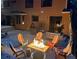 Evening view of the backyard with a patio set up for relaxing around the fire pit at 85 S Sherwood Gln, Monument, CO 80132