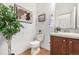 Stylish half-bathroom featuring modern fixtures, wood floors, and tasteful decor creating inviting space at 8802 E 148Th Ln, Thornton, CO 80602