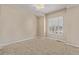 Neutral bedroom with a ceiling fan and a bright window with window shutters at 8802 E 148Th Ln, Thornton, CO 80602