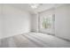 A spacious room with carpet, a ceiling fan and natural light from a window at 8802 E 148Th Ln, Thornton, CO 80602